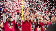 Indiana football players lead fans in a sing-along after winning Big Ten title