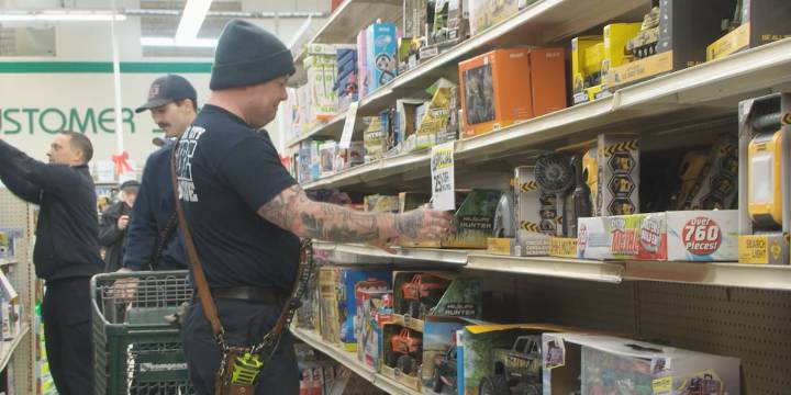 Sioux City firefighters shop for toys for the Salvation Army