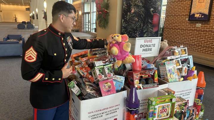 Toys for Tots gave this Marine his first Christmas gift. He worries kids this year won't be so lucky