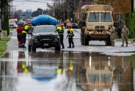 Arctic air sweeps south as residents of the Pacific Northwest remain on guard after severe flooding