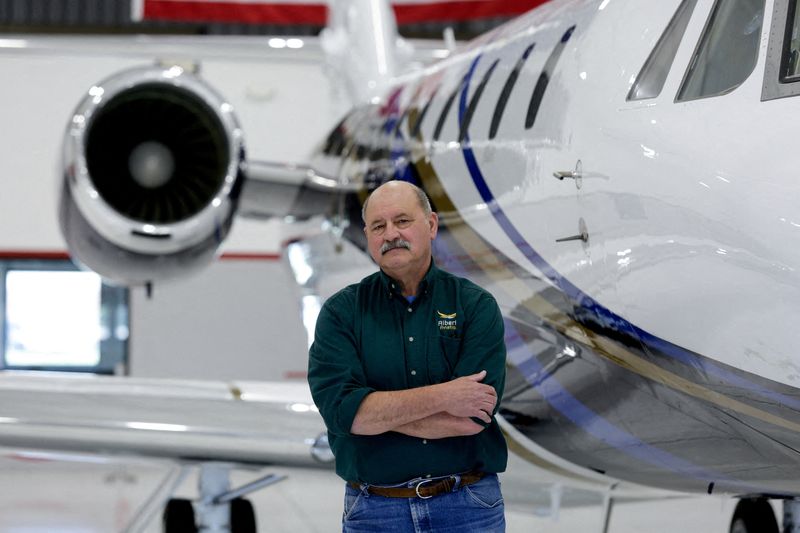 Pinched by higher prices, many Trump voters say: Don't blame the president