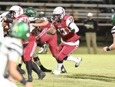 Despite knee injury, QB leads Redbugs into final