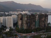 Hong Kong police arrest man for posts about deadly fire