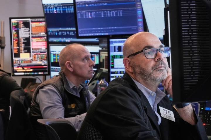 Wall Street hangs near its all-time high as calm continues to hold