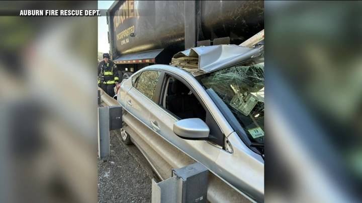 Driver trapped, car lodged under dump truck in unusual crash on Mass Pike in Auburn