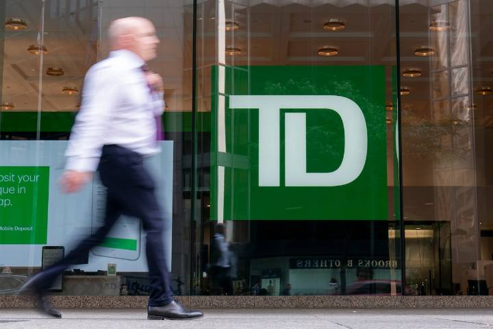 TD posts lower profit on restructuring charges, raises dividend