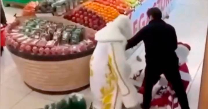 Two Santas furiously brawl in supermarket as horrified shoppers watch Christmas chaos