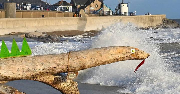 Town's local mascot washed away as Welsh coast battered by huge waves