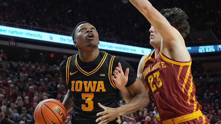 See photos of Iowa State basketball vs Iowa in Cy
