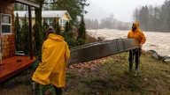 Record flooding threatens Washington as more heavy rain pounds the Northwest
