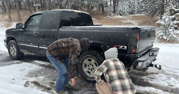 Colorado drivers struggle with chaining up along I-70 during winter storms, despite a new law meant to help