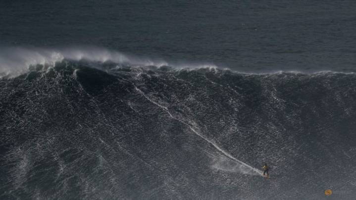 Surfing-Dupont, Chianca claim big wave titles in giant Nazare surf