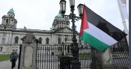 Armed police at Belfast City Hall amid 'chaos' as Palestine flag raised after vote