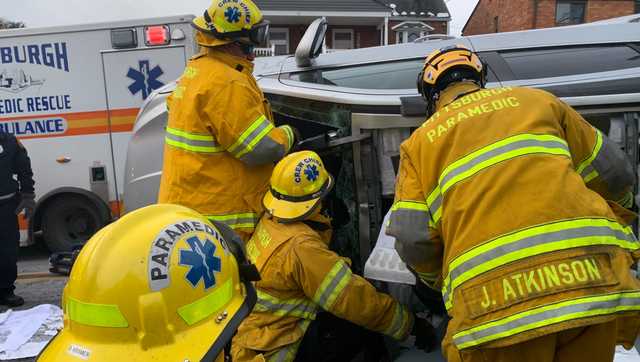 Rescue crews remove roof to free trapped driver after rollover in Pittsburgh