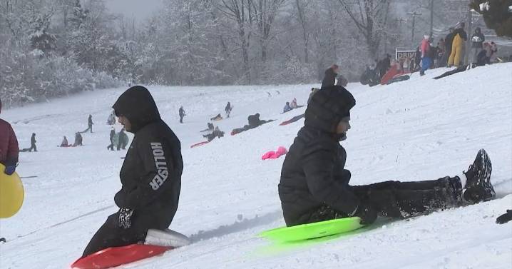 Snowfall brings out sleds and shovels in Washington Township, New Jersey