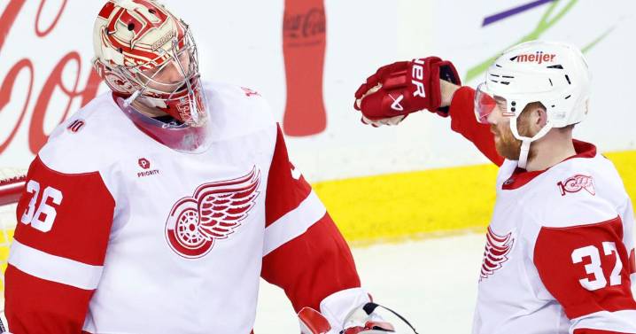 DeBrincat has 2 goals as Red Wings hold off Flames