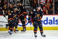 Flames dominate late to douse Wild point streak