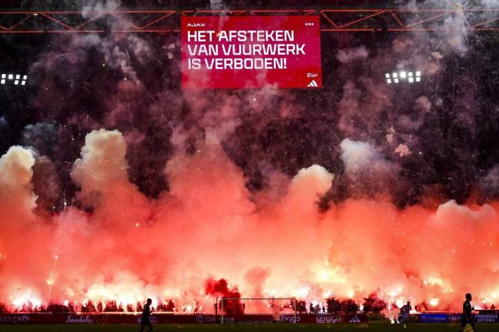Ajax match abandoned in the sixth minute after fans set off fireworks