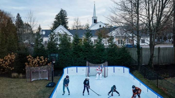 Backyard ice rinks are New England's swimming pools of winter
