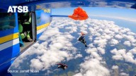 Australian skydiver’s parachute became caught on plane tail 15,000 feet in the air, video shows