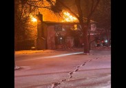 Large house fire in Clay sends one to person to hospital, flames shoot through roof