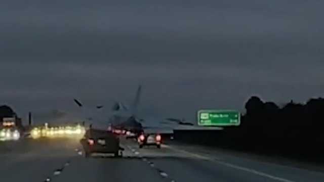 Family helps woman in car struck by plane