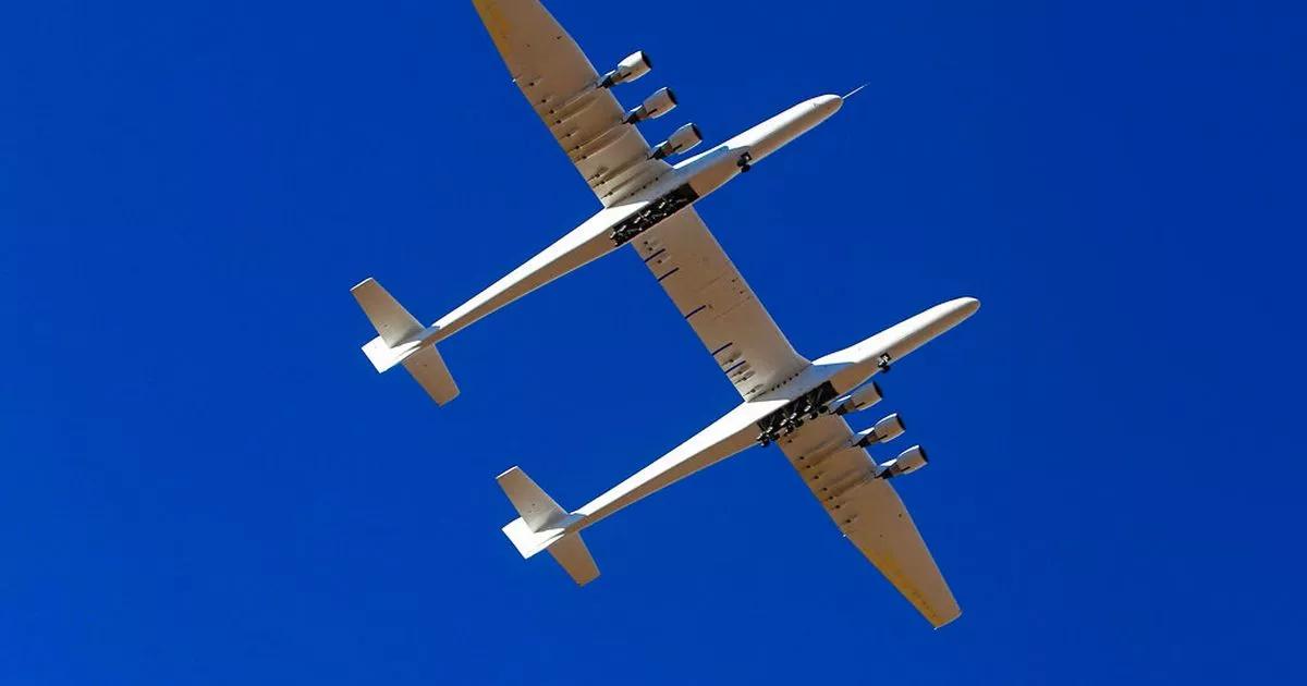 Surprised locals look up and see strange plane bigger than football field flying above