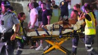 Father and son gunmen allegedly kill at least 15 people in attack on Hanukkah event at Sydney's Bondi Beach