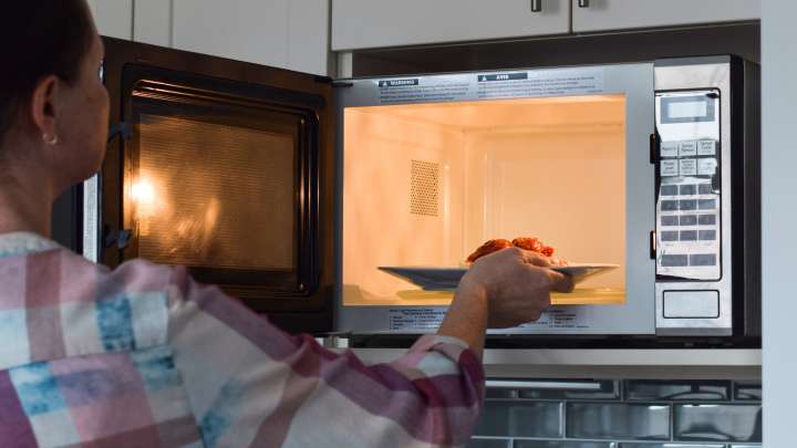 Why You Shouldn't Reheat Leftover Pizza In The Microwave