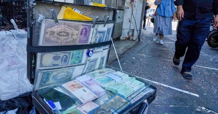 Iran's currency falls to a new low as nuclear sanctions squeeze its ailing economy