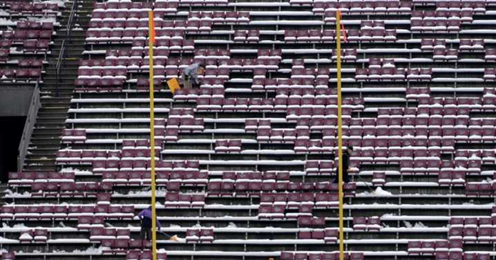 UM shoveling Washington-Grizzly Stadium to prepare for playoff game