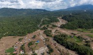 Indonesia races to find missing after massive floods, landslides