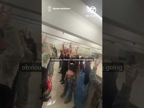 Students shelter during active shooter situation at Brown University before police escort them out