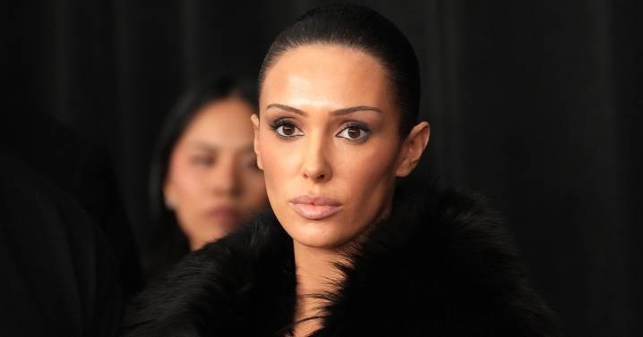 Bianca Censori Rocks Latex Catsuit Paired with an Elegant Bouquet