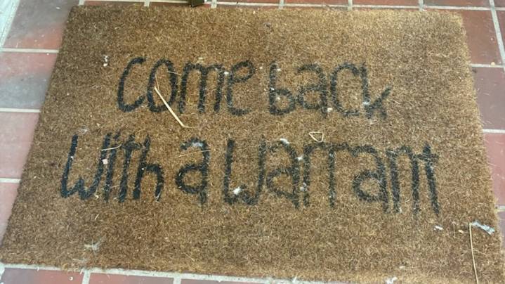 Suspect's doormat tells Florida deputies to 'come back with a warrant'; they do
