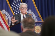 Federal Reserve cuts key rate but signals higher bar for future reductions