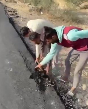 Viral video shows residents tearing up road built just a day ago