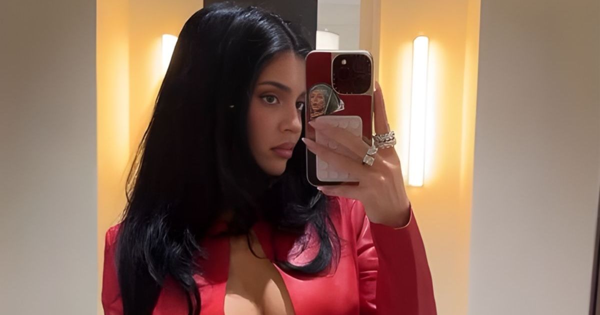 Kylie Jenner Sips on a Drink in Unzipped Crop Top