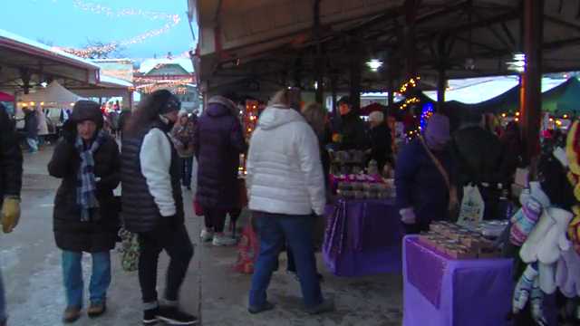 People brave cold for holiday shopping at the Christkinlmarkt in West Allis
