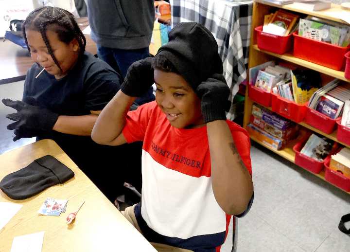 11,000 hats, gloves given away to children in 19 Syracuse schools