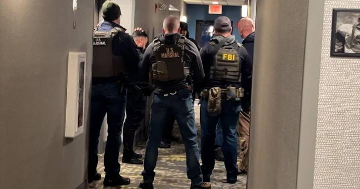 Person of interest in custody in Brown University shooting that left two students dead