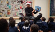 Barack Obama in Santa hat surprises school children during visit to Chicago