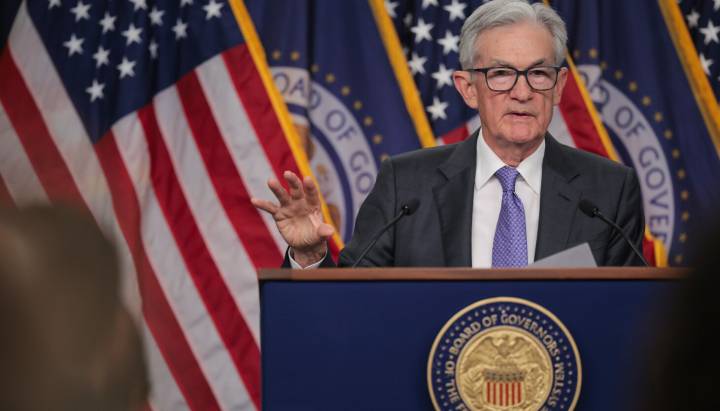 Federal Reserve cuts key rate, sees healthier economy next year