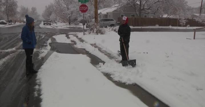 Volunteers spread warmth during Denver’s first major snowfall of the season