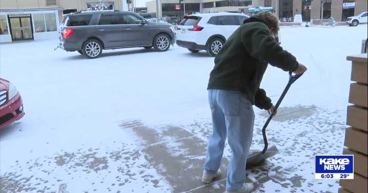 Early morning Kansas snow brings out shovels before dawn