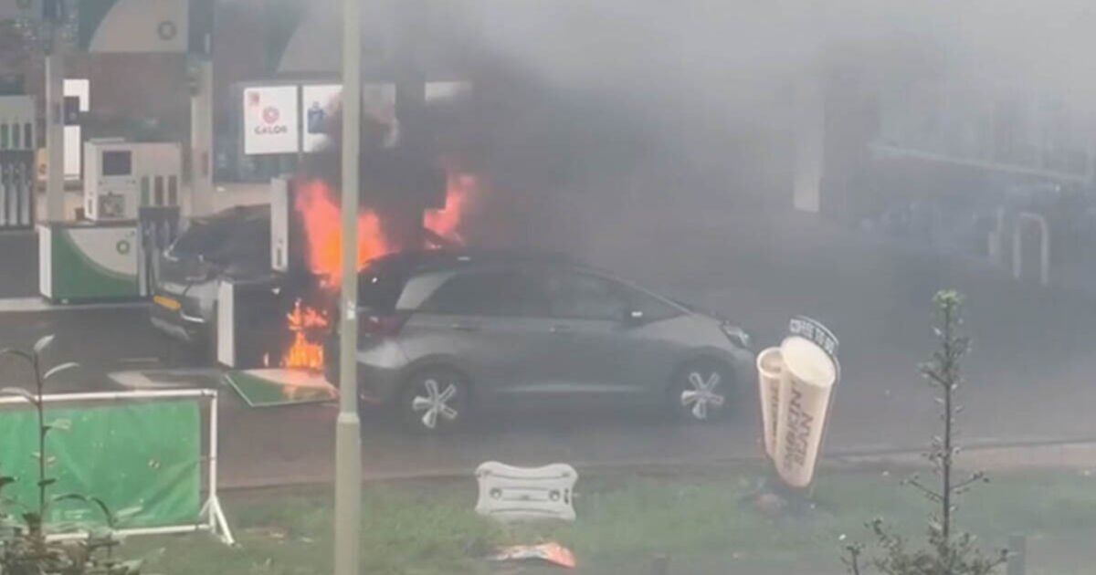 Huge fire rips through cars and petrol pumps as man 'seen with an axe' 