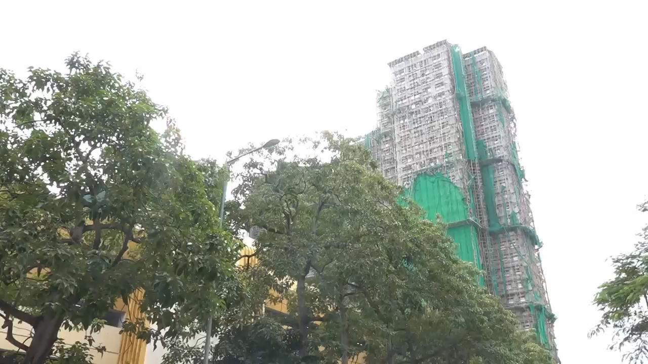 Residents allowed brief return to Hong Kong apartment building that escaped deadly inferno