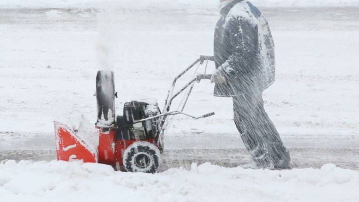 Marengo man suffers hand injury after reaching into snow blower