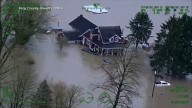 Arctic air plunges south as residents of the Pacific Northwest remain on guard after severe flooding