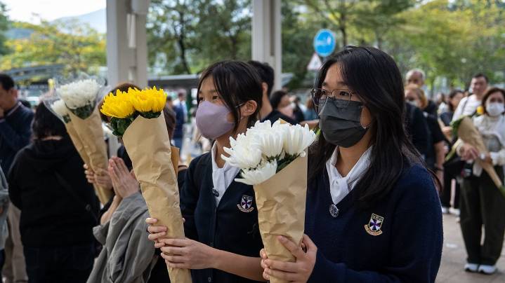 Hong Kong fire probe reveals unsafe netting as public mourns and government stifles dissent
